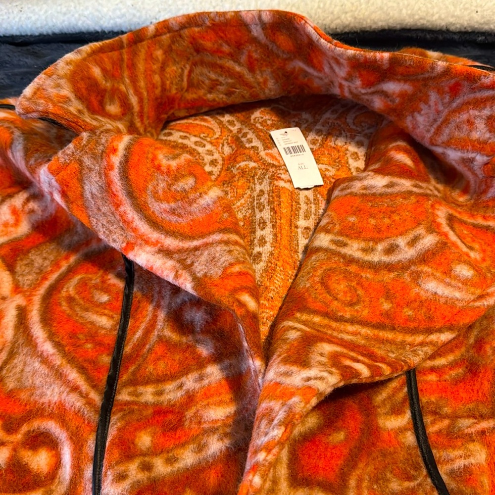 This stunning fall jacket features a unique pattern and has never been worn."